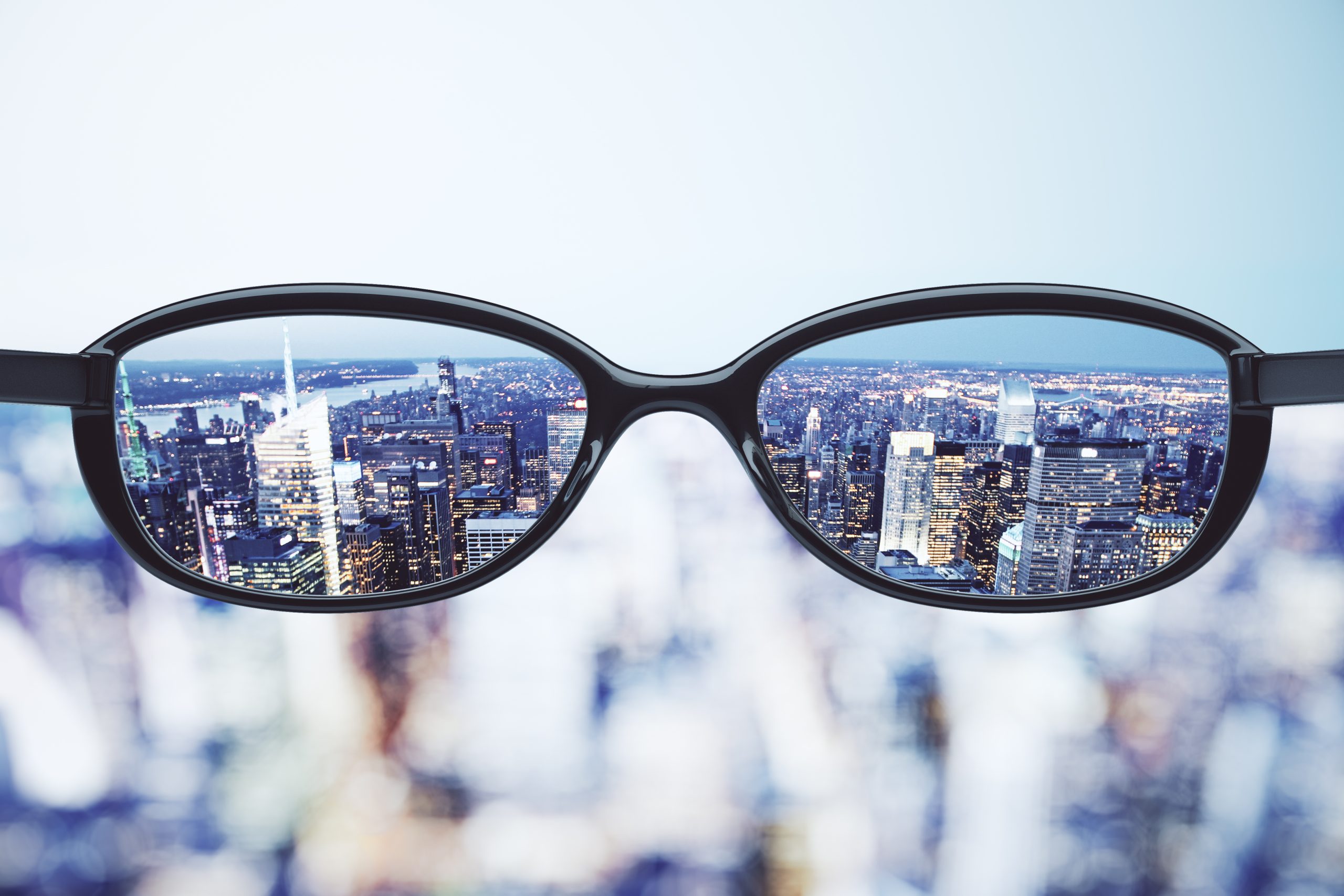 Clear vision concept with eyeglasses and night megapolis city ba Clear vision concept with eyeglasses and night megapolis city background